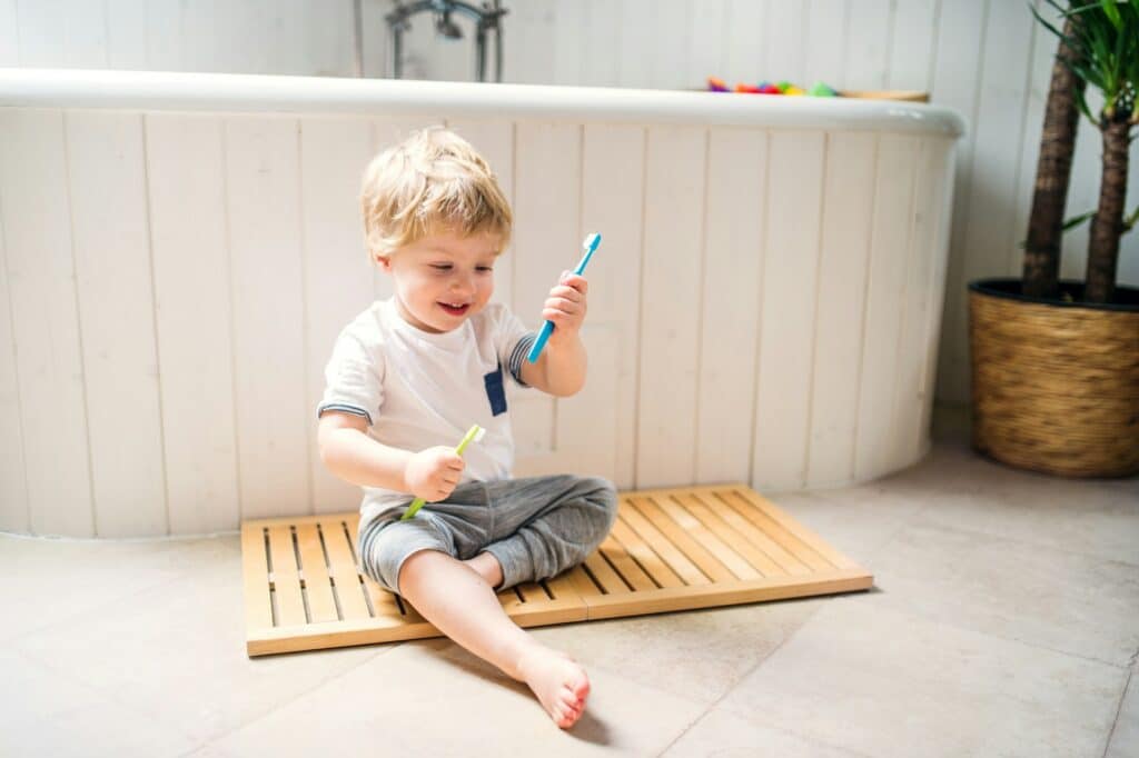 child brushing teeth